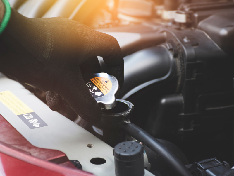 What is the role of coolant in four wheelers?